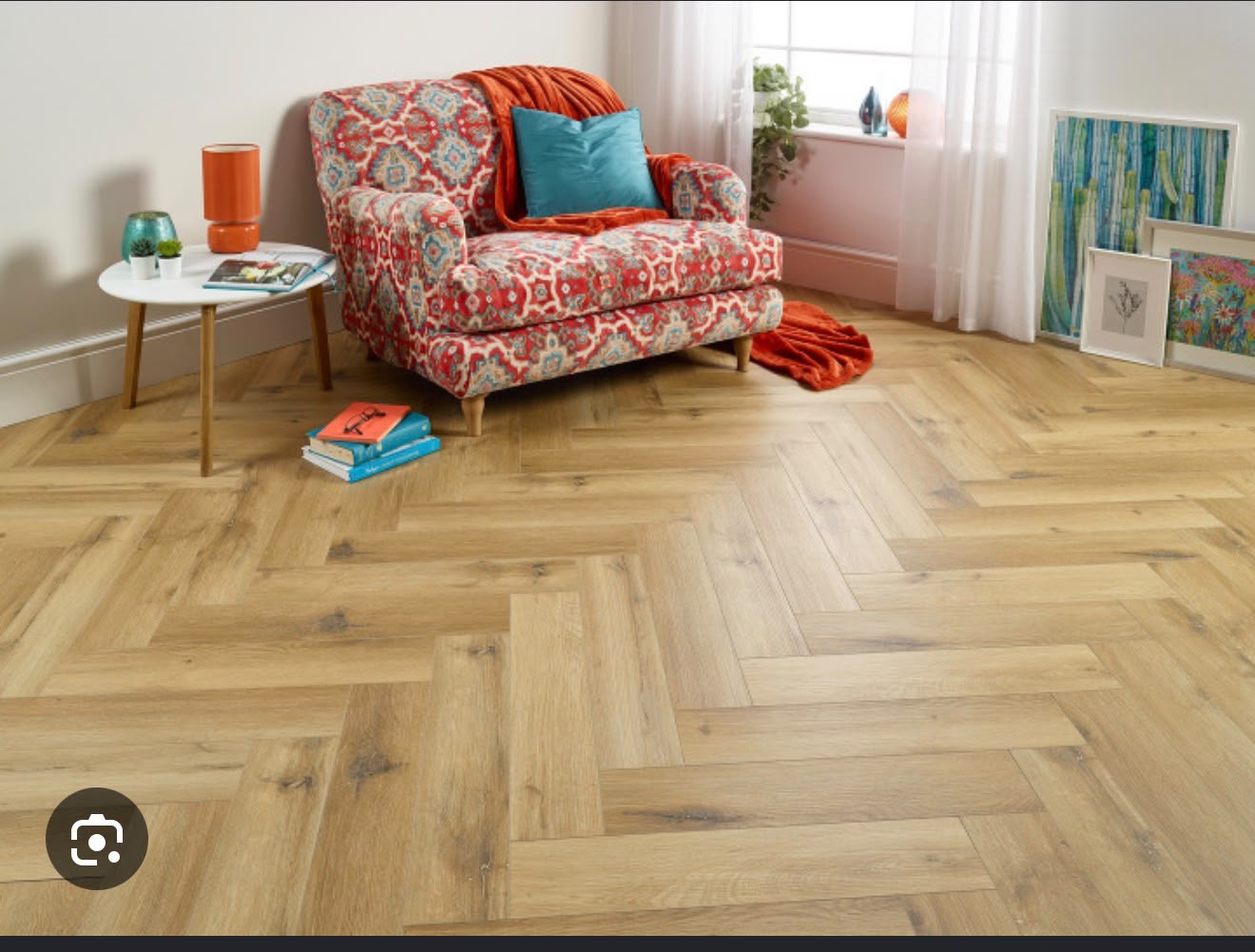 Herringbone LVT flooring in a furnished room